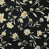 Satin polyester twill printed with ecru flowers and ocher border, black background
