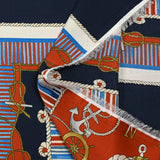Satin polyester twill printed with red and blue marine knots on a midnight blue background