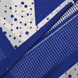 Satin crinkle muslin printed with white and royal blue graphic polka dots