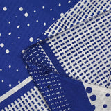 Satin crinkle muslin printed with white and royal blue graphic polka dots