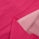 Crêpe polyester élasthanne contrecollé fuchsia