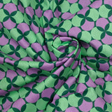 Coated poplin printed with polka dots & purple clover green background