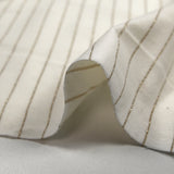 Jersey de coton rayé Lurex doré fond blanc cassé