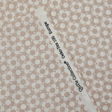 Coated poplin printed with fields of flowers, beige, white background