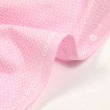 Coton imprimé pois 1mm fond rose layette