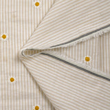 Coton tissé teint brodé marguerite fond rayé blanc et beige