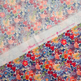 Matilde de algodón Matilde Naranja y flores azules por metro