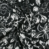 Viscose satin printed flowers in arabesque black background