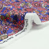 Algodón estampado de mariposa de coral Púrpura por metro