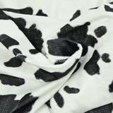 Fausse fourrure poils mi-longs vache noir