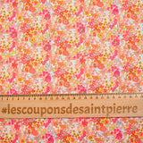 Mandarina y algodón con estampado de flores de mandarín rosa por metro