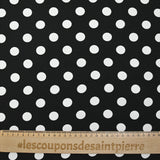 Viscose twill printed with polka dots on a black background