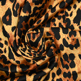 Satin polyester imprimé léopard fond doré