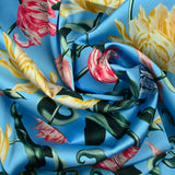 Satin polyester imprimé botanique fond turquoise