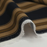 Viscose crepe with brown striped print on black background