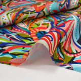 Algodón estampado Zélia azul, caqui y naranja