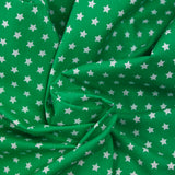 Algodón estampado estrellas 1cm verde