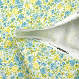 Piqué de coton imprimé les fleurs de Sarah bleu et jaune fond blanc