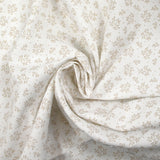 Piqué de coton imprimé brindille dans le vent beige fond blanc