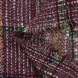 Capucine wool blend tweed green and black line wine background