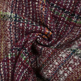 Capucine wool blend tweed green and black line wine background