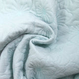 Double gaze matelassée fleurs bleu layette