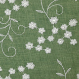 Twill de polyester brodé marguerite fond kaki