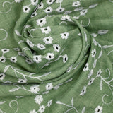 Twill de polyester brodé marguerite fond kaki