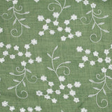 Twill de polyester brodé marguerite fond kaki