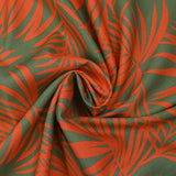 Viscosa estampada hojas tropicales fondo naranja verde