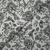 Viscose printed with roses and hummingbirds on a light gray background