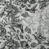 Viscose printed with roses and hummingbirds on a light gray background