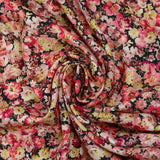 Viscose printed with raspberry heather and yellow black background