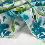 Viscose imprimée fleurs en aquarelle turquoise et vert fond blanc