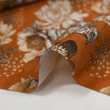 Viscose imprimée chrysanthèmes fond orange brûlé