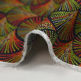 Peacock printed viscose in red, yellow and green dotted black background