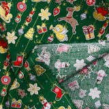 Popeline de coton imprimée esprit de Noël doré fond vert