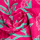 Coton matelassé double face fleurs fuchsia et vert au mètre