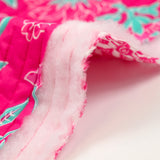 Coton matelassé double face fleurs fuchsia et vert au mètre