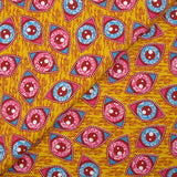 Coton imprimé ethnique Kampen fuchsia et turquoise fond jaune
