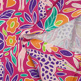 Coton imprimé amour de girafes fond fuchsia