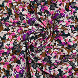 Viscose printed with purple, fuchsia and brown Ornella flowers