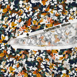 Viscosa estampada con flores de Ornella en naranja quemado, pato y azul marino