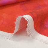 Jacquard de viscose satiné imprimé taches florales fond orange