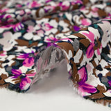Viscose printed with purple, fuchsia and brown Ornella flowers