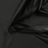 Tela de sastrería de poliéster negro.