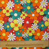 Coton imprimé floraison disco rouge, orange et turquoise