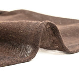 Fine iridescent golden wool knit with brown background