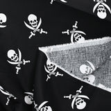 Coton imprimé les pirates de l’au-delà fond noir