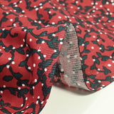 Fondo rojo arabesco estampado de algodón Poplin